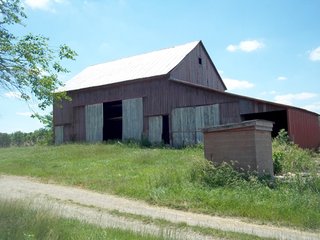 18.373 Acres (13 acres of productive cropland w/0.5 acres of CRP waterways).

- 3 Miles to I-70 exchange.
- 1800's Brick Federal home w/2700 SF.
- Stocked pond for family recreation.
- 1700 Ft. of road fronatage.
- A mix of woodland and tillable land. - 18.373 Acres with Country Home